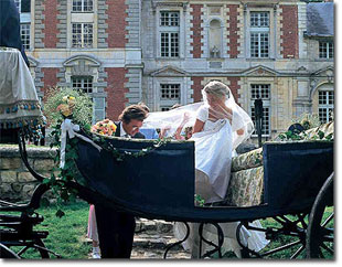 Bride and groom take a carriage ride